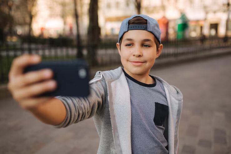 Young man taking a selfie with his smartphone