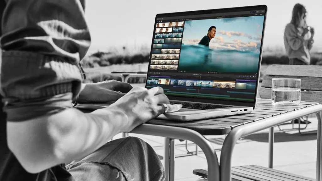 Photographer editing images on MacBook